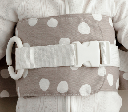 Close-up of the the Spotty Dotty WriggleBum nappy change harness. 
